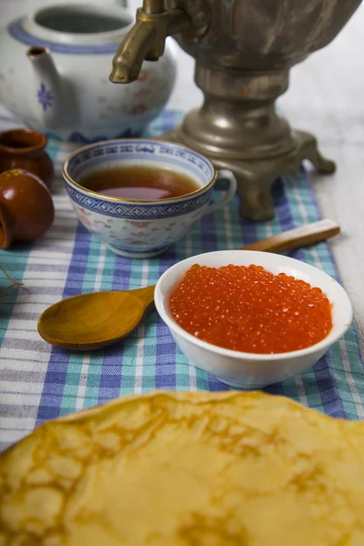 Pancakes with caviar on the table — Stock Photo, Image