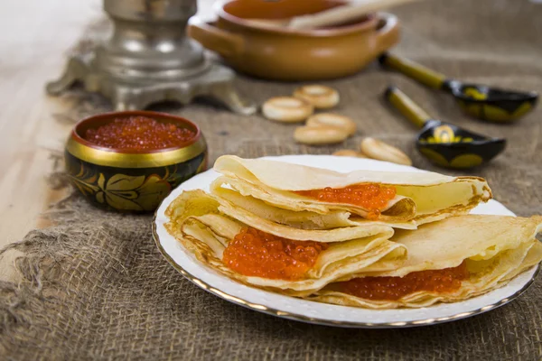 Pancakes with caviar on the table — Stock Photo, Image