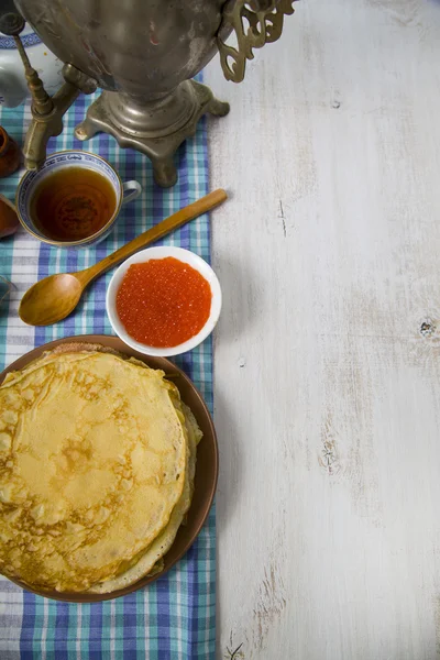 Pancakes with caviar on the table — Stock Photo, Image