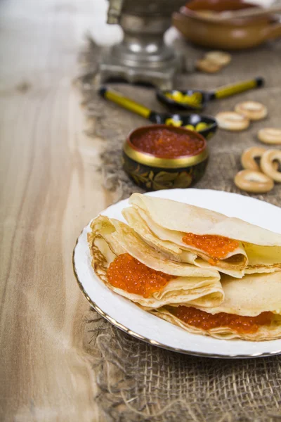 Pancakes with caviar on the table — Stock Photo, Image