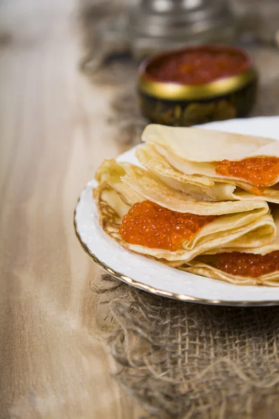 Pancakes with caviar on the table — Stock Photo, Image