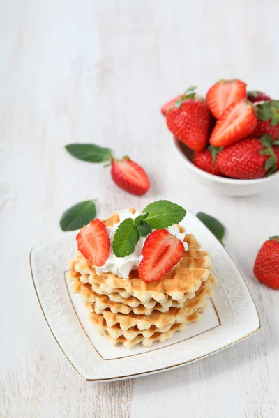 Waffles, mint and ripe strawberries. — Stock Photo, Image