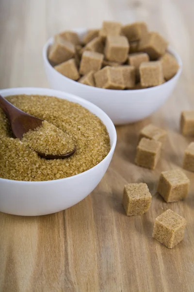 Cane sugar in a white bowls — Stock Photo, Image