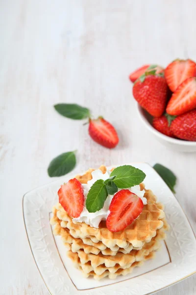 Delicious waffles with strawberries and mint — Stock Photo, Image