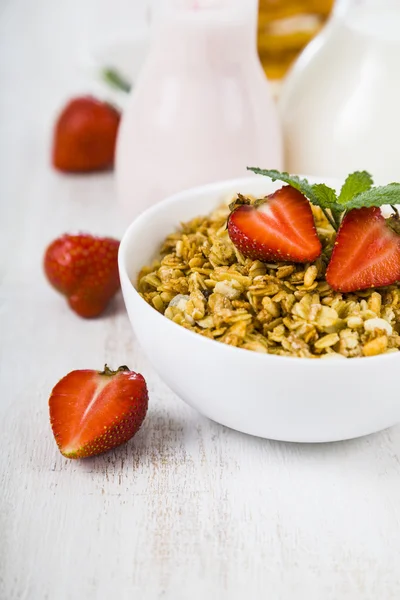 Granola with strawberry on a wooden table — Stock Photo, Image