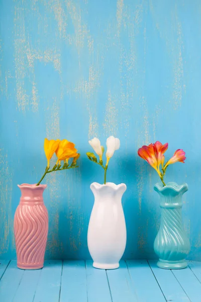 Three Vases Freesias Blue Background Beautiful Flowers — Stock Photo, Image