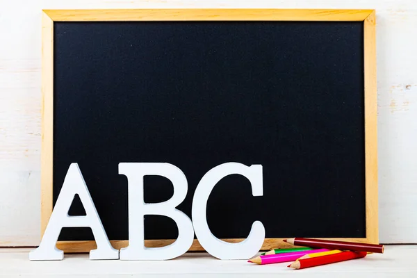 Letters ABC and chalk board. Back to school. Stationery.