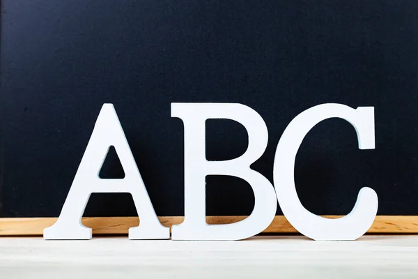 Letters ABC and chalk board. Back to school. Stationery.