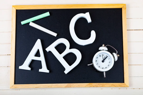 Letters ABC and chalk board. Back to school. Stationery.