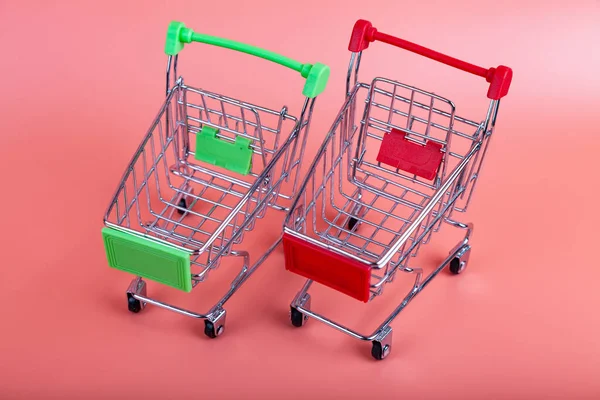 Two Shopping Carts Pink Background Shopping Concept — Stock Photo, Image