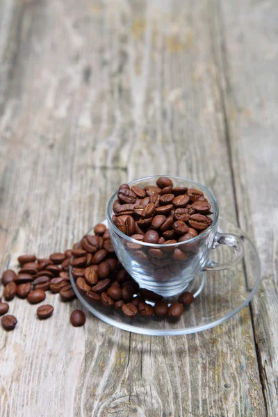 Tasse Kaffee auf einem hölzernen Hintergrund — Stockfoto