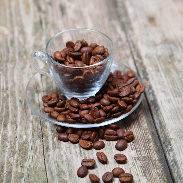 Kopje koffie op een houten achtergrond — Stockfoto