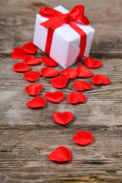 Holidays gift and red hearts — Stock Photo, Image