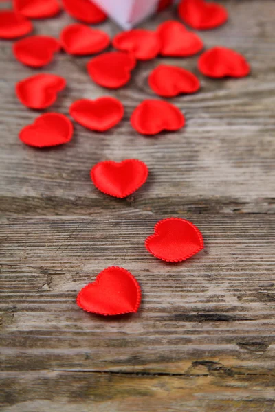 Holidays gift and red hearts — Stock Photo, Image