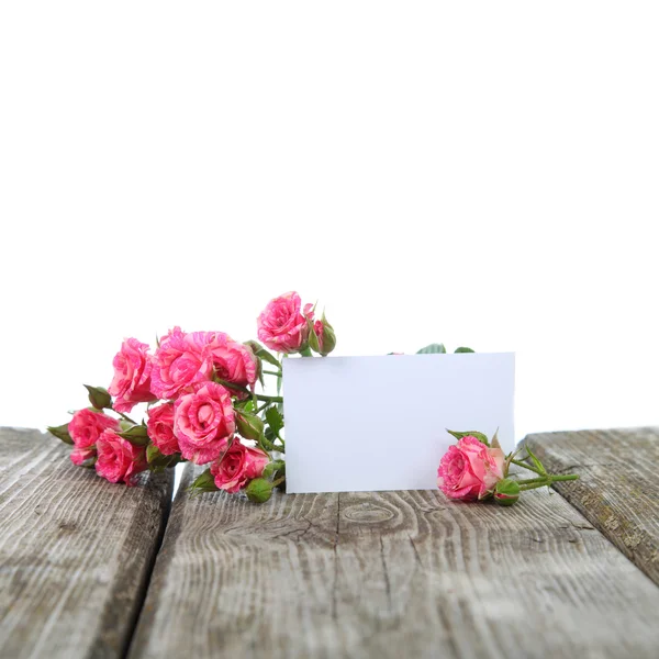 Rosas rosadas y tarjeta de felicitación — Foto de Stock