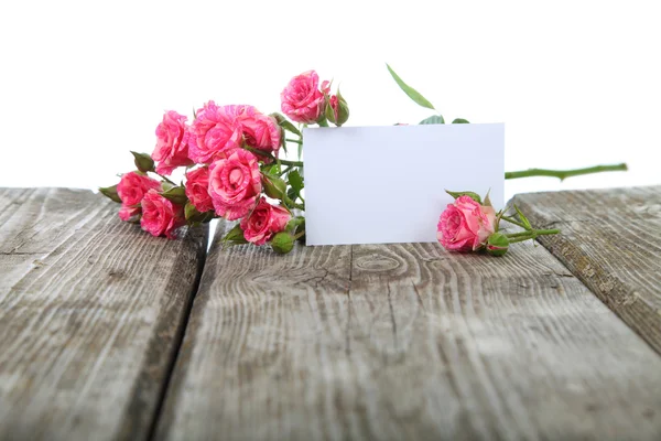 Pink roses and greeting card — Stock Photo, Image