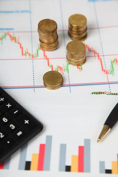 Calculator and stacks of coins — Stock Photo, Image