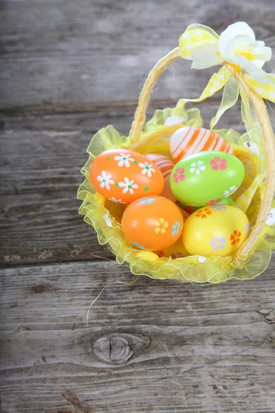 Easter composition with eggs in a basket — Stock Photo, Image