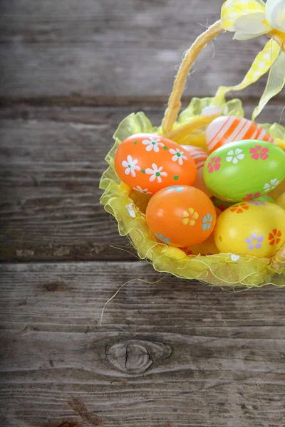 Easter composition with eggs in a basket — Stock Photo, Image