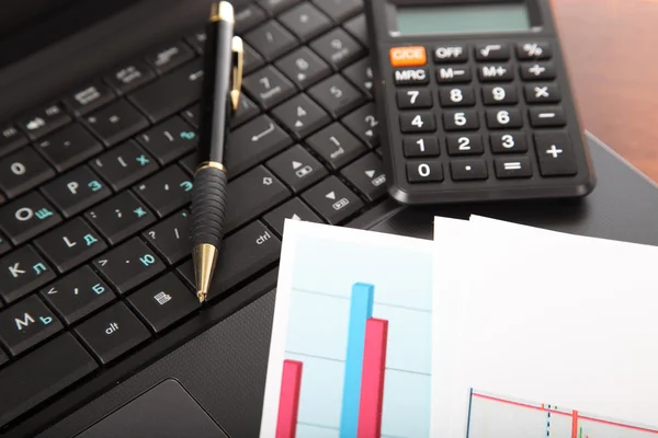 Calculator, laptop and financial documents — Stock Photo, Image