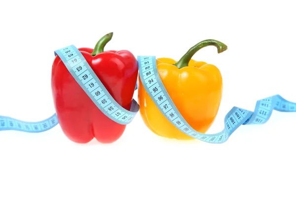 Sweet peppers and measuring tape — Stock Photo, Image