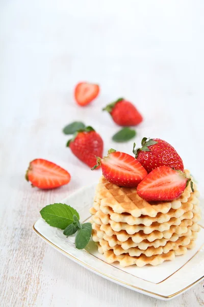 Waffles, mint and ripe strawberries. — Stock Photo, Image