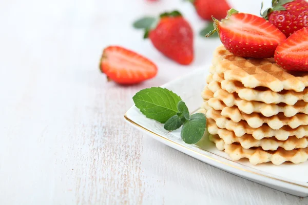 Waffles, mint and ripe strawberries. — Stock Photo, Image