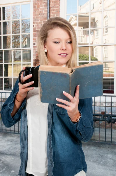 Woman with coffee and book — Stock Photo, Image