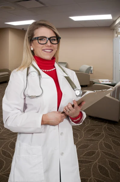 Woman Doctor with patient records — Stock Photo, Image