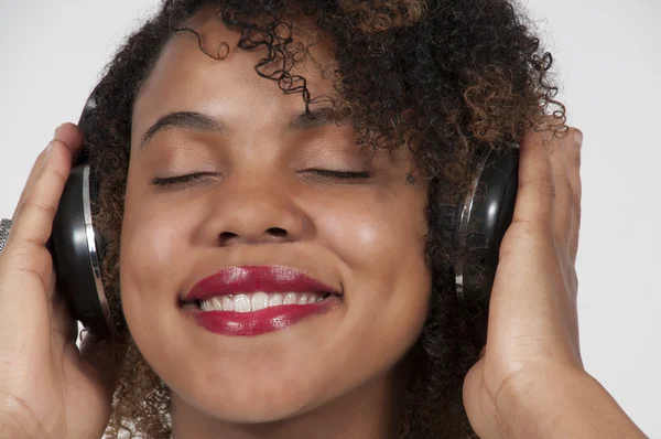 Beautiful Woman listening to Headphones — Stock Photo, Image