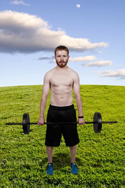 Człowiek podnoszenia masy ciała — Zdjęcie stockowe