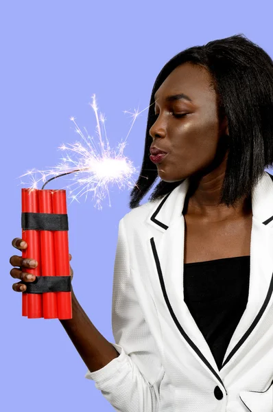 Young woman holding dynamite — Stock Photo, Image