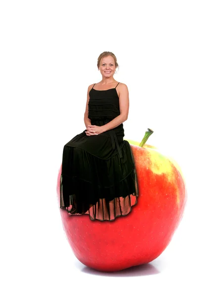 Woman Sitting on Red Delicious Apple with Nutrition Label — Stock Photo, Image