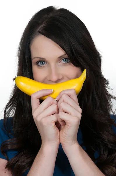 Женщина с бананом — стоковое фото