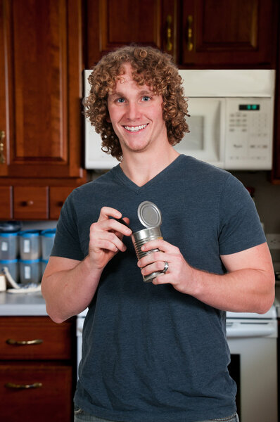 Man eating canned food