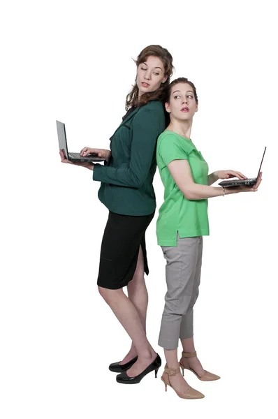 Las mujeres usando computadoras portátiles —  Fotos de Stock