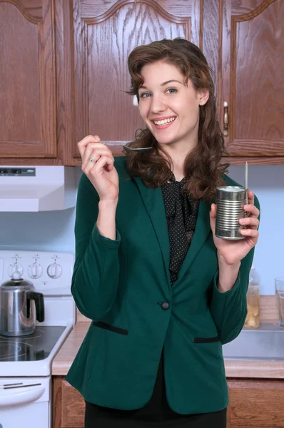 Woman eating from a can — Stock Photo, Image