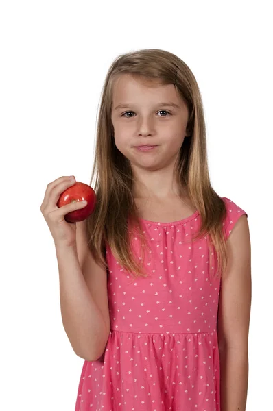 Liten flicka äter ett äpple — Stockfoto