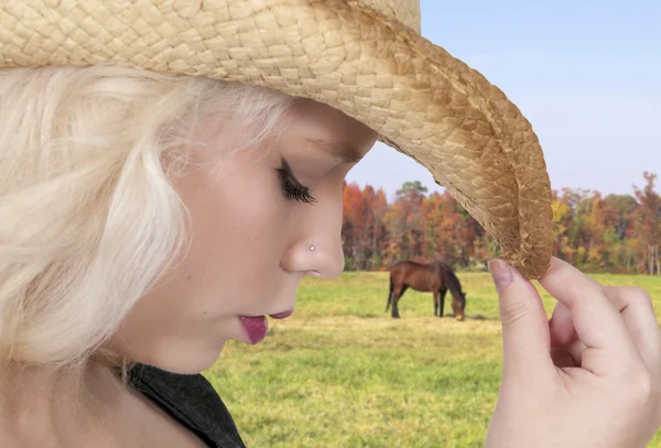 Young beautiful woman wearing a cowboy hat — Stock Photo, Image