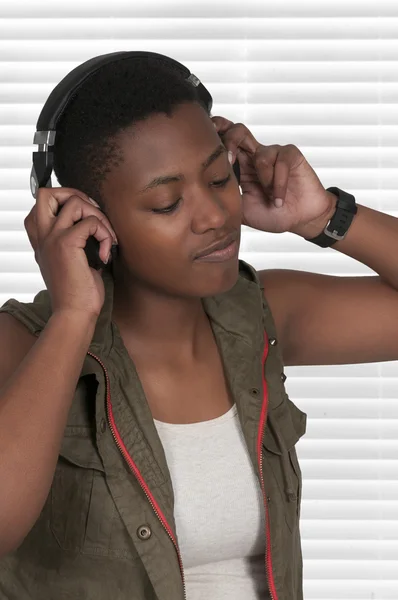 Beautiful Woman listening to Headphones — Stock Photo, Image