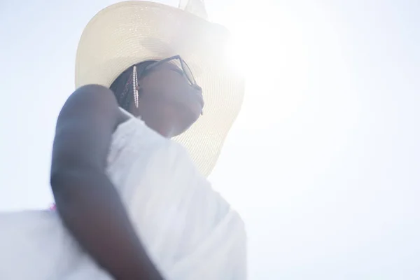 Beautiful young black African American woman on tropical beach Stock Photo