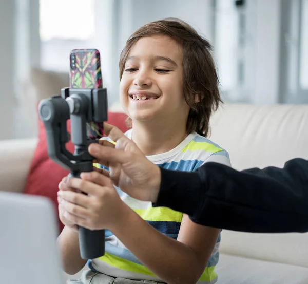 Little boy recording video content ,High quality photo