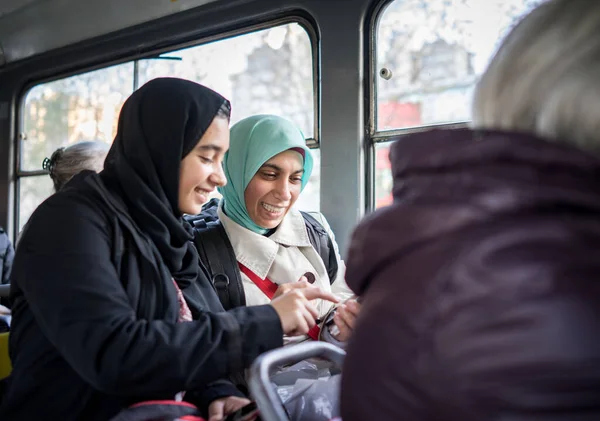 Mother and daughter riding public transport in city — Stock Photo, Image