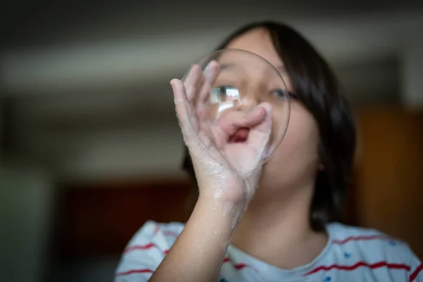 Little creative kid having fun with soap bubble during lockdown — Stock Photo, Image