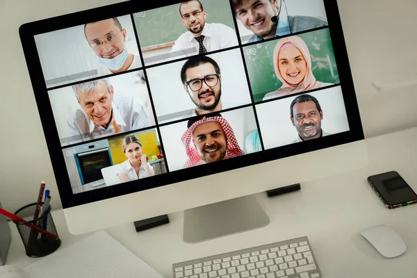 Online business conference screen in hands