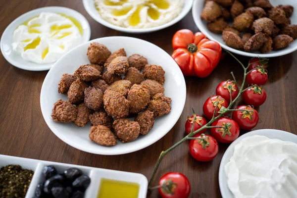 Preparing delicious falafel at home on table — Stock Photo, Image