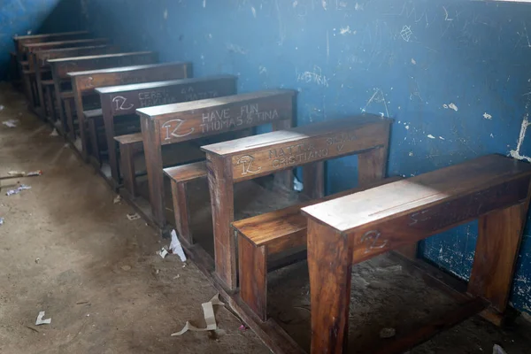 Poor school classroom in Tanzania with names of their supporters children