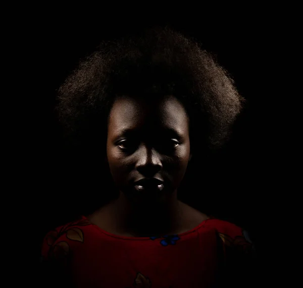 Dark portrait of young black woman