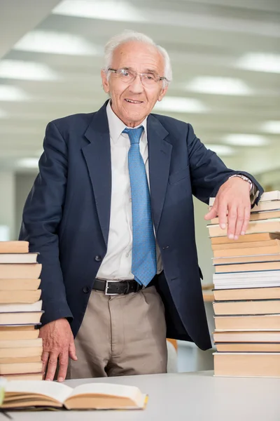 Elderly professor inside college Royalty Free Stock Images