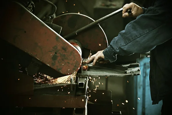 Worker cutting iron with professional tool — Stock Photo, Image